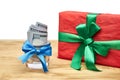 Gift and money on a wooden table Royalty Free Stock Photo