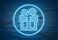 Gift neon icon illuminating a brick wall with blue glowing light 3D rendering