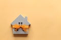 Gift new home and Real estate concept,Model house with Orange ribbon on colorful background Royalty Free Stock Photo