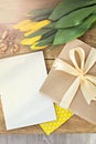 Gift, notebook, yellow tulips Royalty Free Stock Photo