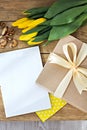 Gift, notebook, yellow tulips Royalty Free Stock Photo