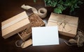 Blank Card, Gift Packaging Boxes, Jute String, and Tags with Small Key on Wood Surface Ready For Your Branding Blank Card Royalty Free Stock Photo