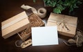 Gift Packaging Boxes Mock Up with Jute String, Thank You and Congratulations Card and Tags with Small Key on Wood Surface Royalty Free Stock Photo