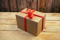 Gift parcel or mail box with ribbon red bow, brown carton parcel, surprise