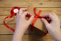 Gift parcel or mail box with ribbon red bow, brown carton parcel, surprise