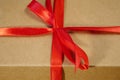 Gift parcel or mail box with ribbon red bow, brown carton parcel, surprise