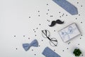 Gift Or Present Box, Bowtie, Moustache, Glasses And Confetti For Happy Father Day. Top View And Flat Lay