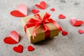 Gift Present box of craft paper with red ribbon, red hearts. Valentine`s Day concept