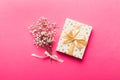 Gift or present box and flower gypsophila on light table top view. Greeting card. Flat lay style with copy space Royalty Free Stock Photo