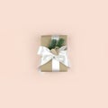 Gift or present box on pink background. Minimalist Christmas composition in trendy pastel color. Royalty Free Stock Photo