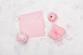 Gift or present box, pink paper blank and ranunculus flower on white table from above for wedding mockup or greeting card flat lay Royalty Free Stock Photo