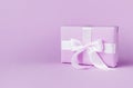 Gift or present box on violetbackground. Royalty Free Stock Photo
