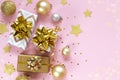 Gift or present boxes, decoration balls and golden stars on table top view. Flat lay composition for Christmas, new year. Royalty Free Stock Photo