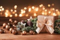 Gift or present boxes, snowy fir tree and golden holiday decoration on wooden table against magic bokeh lights. Christmas greeting Royalty Free Stock Photo