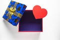 Gift or present empty box with golden ribbon and paper heart Royalty Free Stock Photo