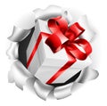 Gift Present Ripping Through Background Royalty Free Stock Photo