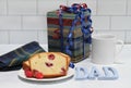 A gift, raspberry pound cake and coffee with the word Dad for his special day Royalty Free Stock Photo