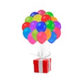 Gift in red box fly with many multi-coloured balloons on white background Royalty Free Stock Photo