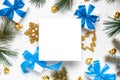 Gift ribbon box. White gift box with blue ribbon, New Year balls and Christmas tree in xmas composition on white background for Royalty Free Stock Photo