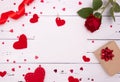 Gift, rose and red hearts on white wooden background, top view. Copyspace, a Valentine`s Day concept Royalty Free Stock Photo