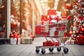 Gift shopping concept, supermarket trolley full gift boxes in christmas decorated mall