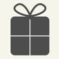 Gift solid icon. Christmas present with bow glyph style pictogram on white background. New Year giftbox for mobile