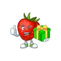 With gift strawberry fruit mascot for cartoon character