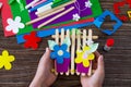 A gift of summer flowers on wooden sticks a fence on a wooden table. Handmade.