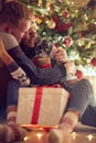 Gift surprise for Christmas- couple in love at Christmas night