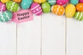 Gift tag with Easter egg top border against white wood Royalty Free Stock Photo