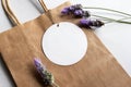 Gift tag mockup - Round gift tag surrounded by lavender flowers