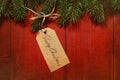 Gift tag on red wood background Royalty Free Stock Photo