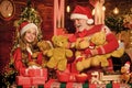 Gift teddy bear toy for kid. Boxing day. Family values. Child enjoy christmas with grandfather Santa claus. Happiness