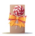 A gift tied with a ribbon and decorated with a lollipop with a spiral pattern. Christmas decor. Happy new year.Box in Royalty Free Stock Photo