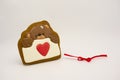 Gift for Valentine`s Day. Original gingerbread, a bear with a heart