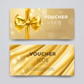 Gift voucher design template. Set of premium promotional card with realistic golden bow, ribbon and silk isolated on bokeh Royalty Free Stock Photo