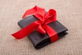 Gift wallet wrapped with red ribbon