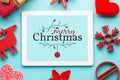 Gift white tablet with Christmas ball, box and red chain Royalty Free Stock Photo