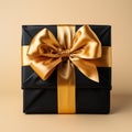 Gift wrap. Black and yellow box with a bow on a plain background Royalty Free Stock Photo