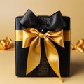 Gift wrap. Black and yellow box with a bow on a plain background Royalty Free Stock Photo