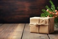 a gift wrapped in eco-friendly brown paper on a wooden table