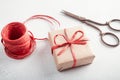 Gift wrapped in paper, scissors, raffia cord . Zero waste celebration concept