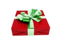 Gift wrapped in red paper with a green bow and ribbons for a gif Royalty Free Stock Photo