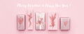 Gift wrapping banner. Pink nordic christmas gifts isolated on pastel pink background.