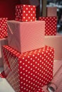 Gift wrapping, Beautiful Red Holiday Gift Boxes with a Gift for Christmas Royalty Free Stock Photo