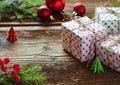 Gift wrapping. Christmas composition with present box, packing paper, festive decoration and fir tree branch. Preparation for holi Royalty Free Stock Photo