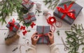 Gift wrapping. Packaging modern christmas present in boxes Royalty Free Stock Photo