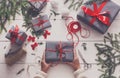 Gift wrapping. Packaging modern christmas present in boxes Royalty Free Stock Photo