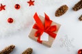 Gift wrapping. Packaging modern christmas present boxes in stylish gray paper with satin red ribbon. Top view of hands Royalty Free Stock Photo