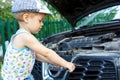 Gifted kid repairing car engine Royalty Free Stock Photo